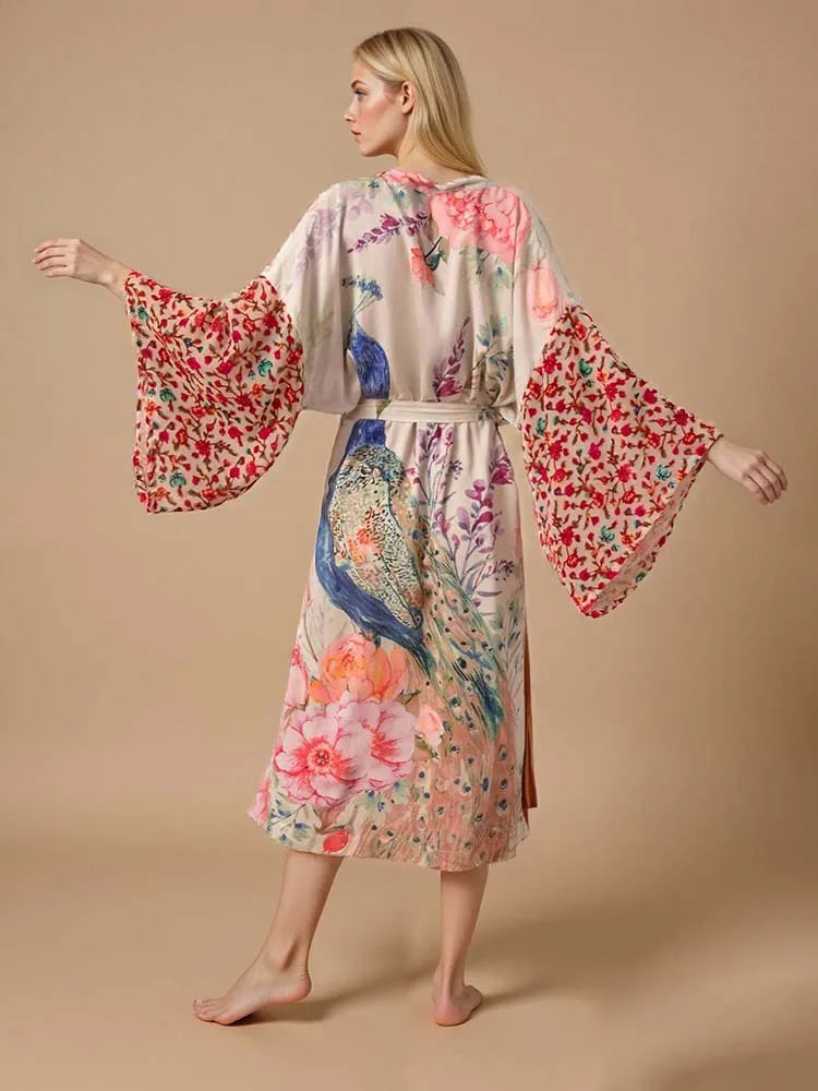 Woman wearing a long peacock print kimono swim cover-up, lightweight beach cardigan perfect over bikinis or swimsuits.