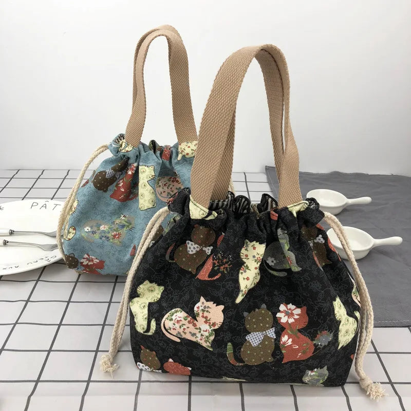 Canvas bento tote holding two lunch boxes