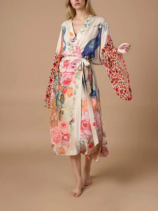 Woman wearing a long peacock print kimono swim cover-up, lightweight beach cardigan perfect over bikinis or swimsuits.