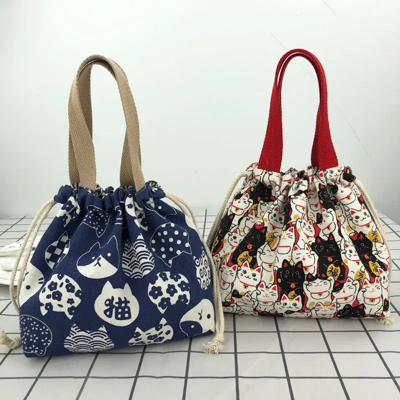 Canvas bento tote holding two lunch boxes