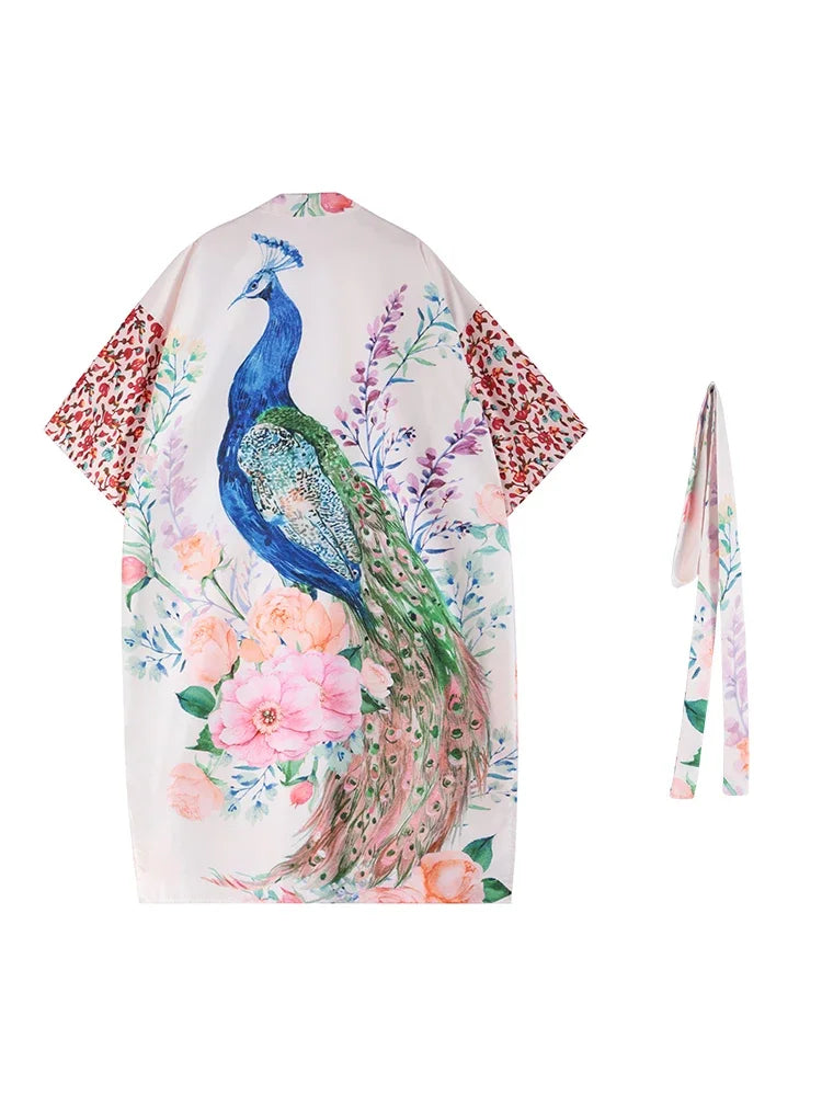 Woman wearing a long peacock print kimono swim cover-up, lightweight beach cardigan perfect over bikinis or swimsuits.